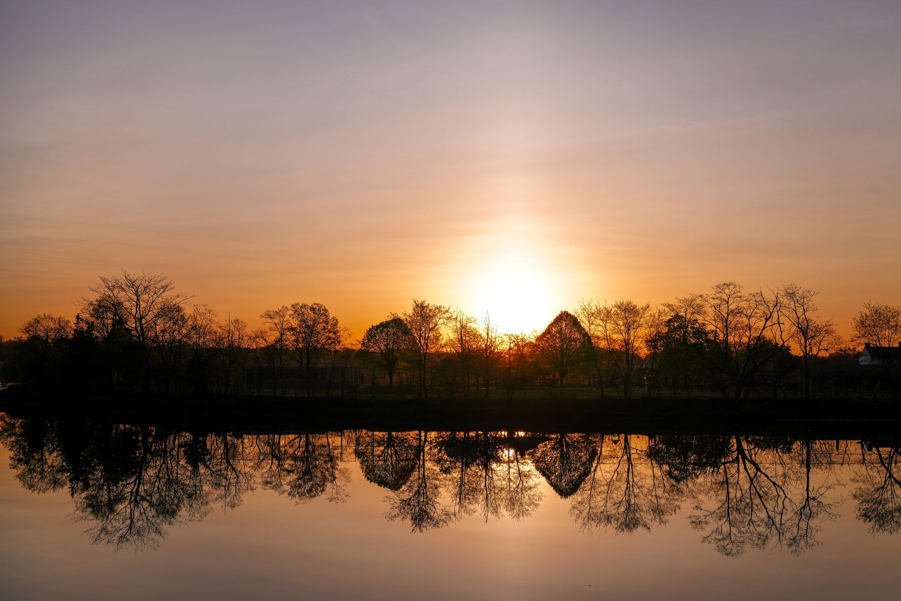 Sunrise reflected over Holly Pond in Stamford, Connecticut