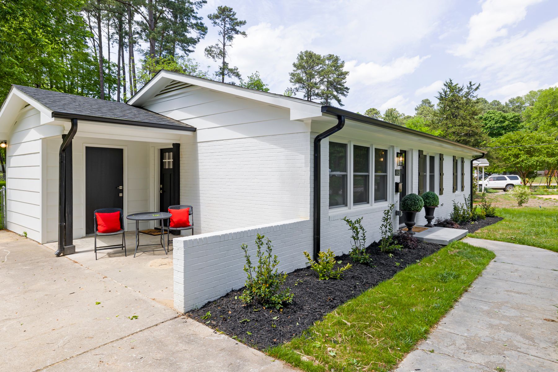 American home with painted siding and landscaped grounds